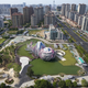 Illustration for article titled Flower-Shaped Buildings Turn Cities Into Artificial Gardens